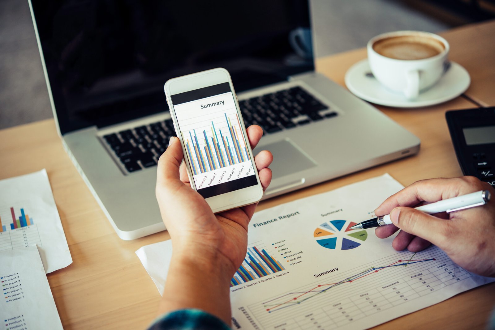 documents graphs and smartphone , analyzing investment chart wor